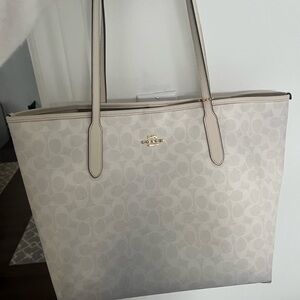Coach white signature canvas tote bag.